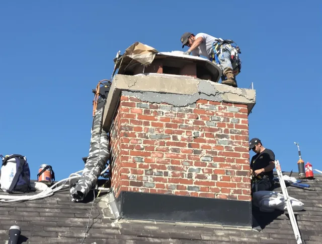 Branford Chimney Sweep installing a custom chimney crown in Branford, CT
