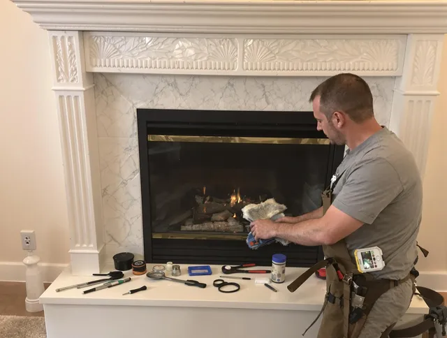 Branford Chimney Sweep performing fireplace maintenance in Branford, CT