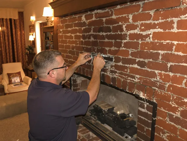 Branford Chimney Sweep expert fixing a fireplace in Branford, CT
